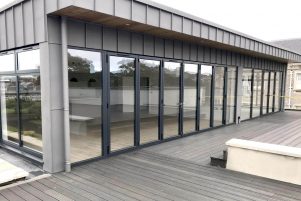 Grey sliding folding doors with wide span