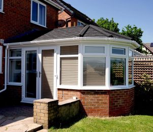 An existing conservatory with new tiled solid roof to transform it into an extension