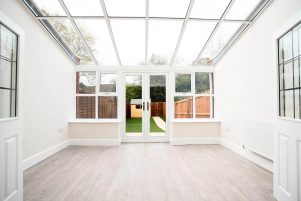 Internal view of a lean-to style conservatory with uPVC windows and doors