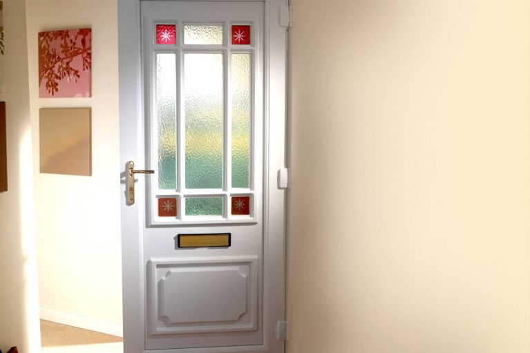 uPVC front door with decorative glass