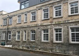 White casement window commercial installation