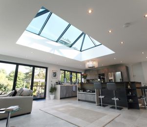 REAL Ali Glazed Extension with Lantern Roof and black ali sliding door Kitchen living room